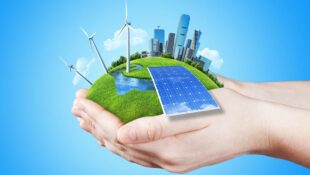 hands-holding-clear-green-meadow-with-sun-battery-block-wind-mill-turbines-and-city-skyscrapers-concept-for-ecology-growing-business-freshness-freedom-and-other-lifestyle-issues-green-fields-col